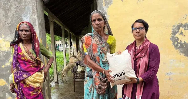 Surat: Distribution of ration kits by Adani Foundation in three flood affected villages of Bharuch.  Loktej Surat, Business News